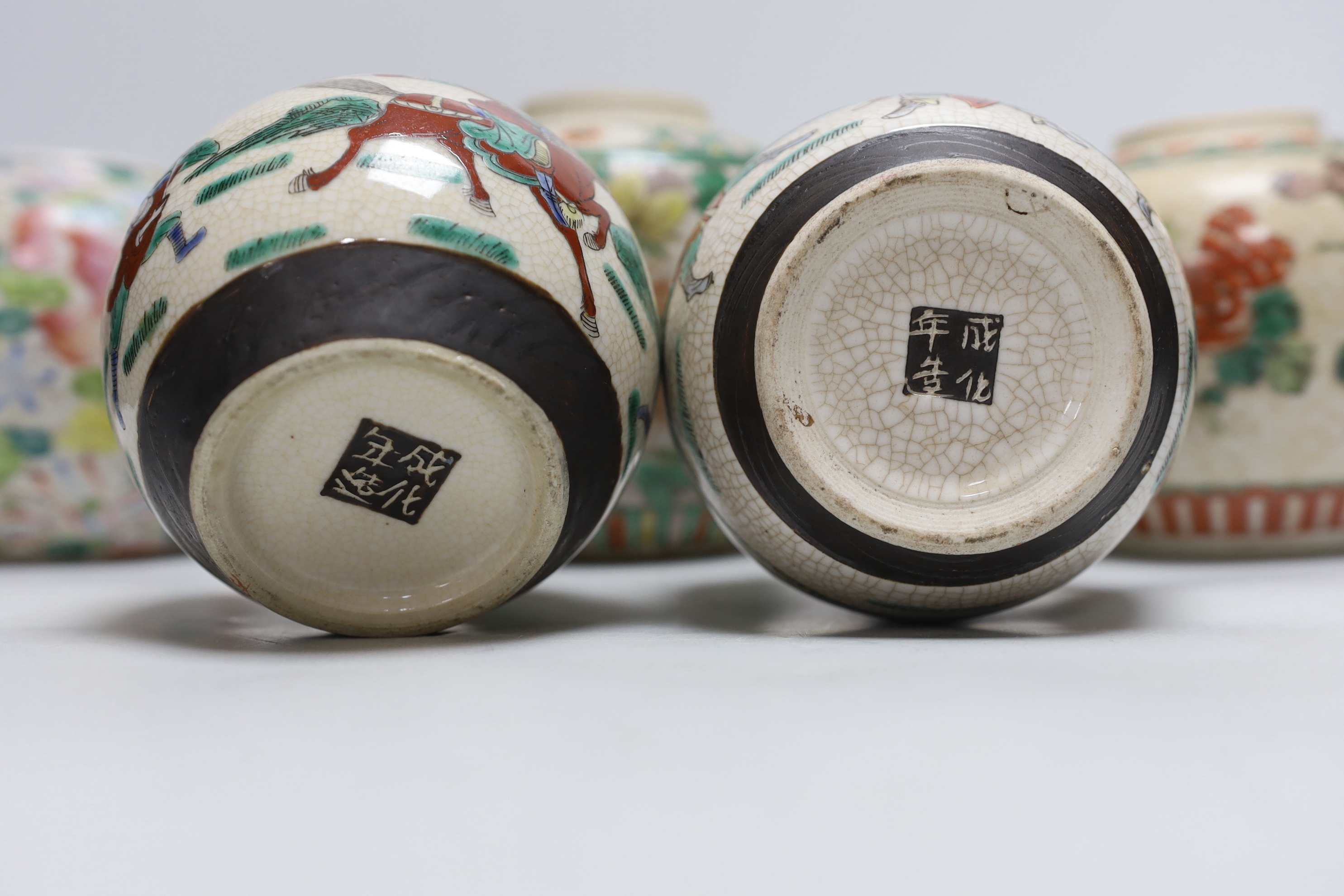 Five Chinese enamelled porcelain ginger jars, one with a cover, tallest 12cm high
